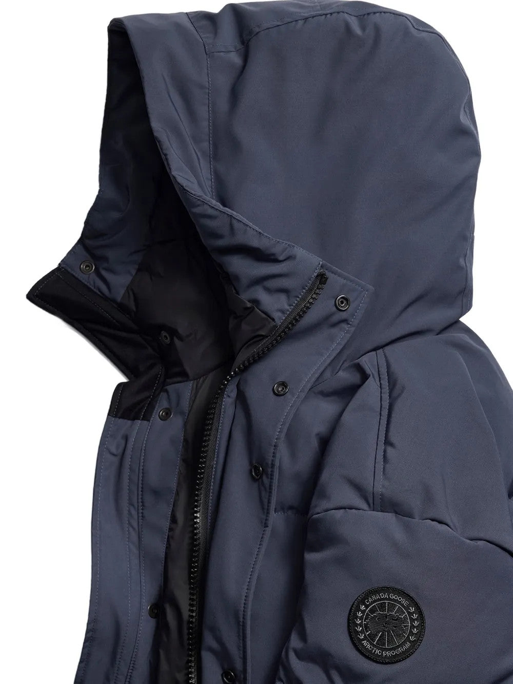 Close up of Navy jacket, showing texture of the 84% recycled polyester/ 16% organic cotton made fabric