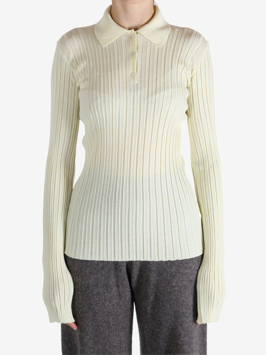 White shirt worn by a person, showing the shirt's fit