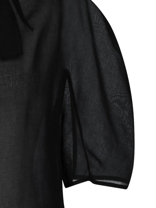 Close up of black top, showing texture of the polyester fabric