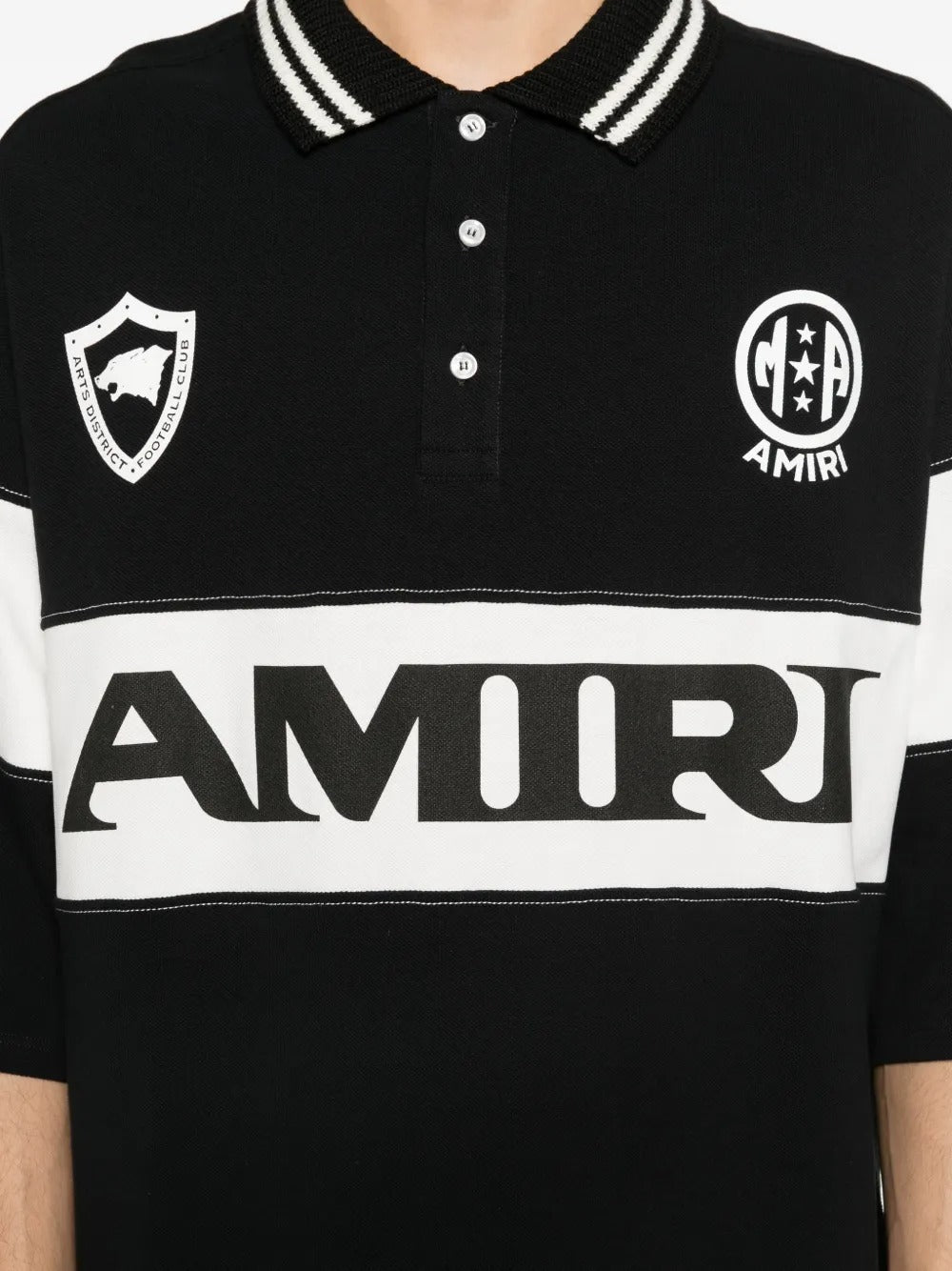 Close up of black t-shirt, showing texture of the cotton fabric