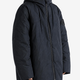 Black jacket worn by a person, showing the jacket fit