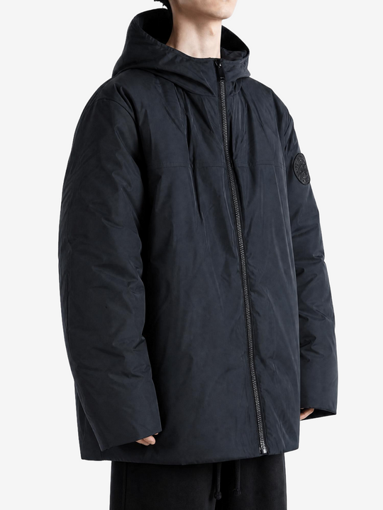 Black jacket worn by a person, showing the jacket fit