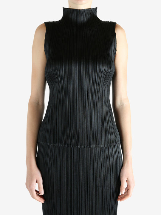 Black shirts worn by a person, showing the shirts fit