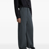 Grey pants worn by a person, showing the pants fit