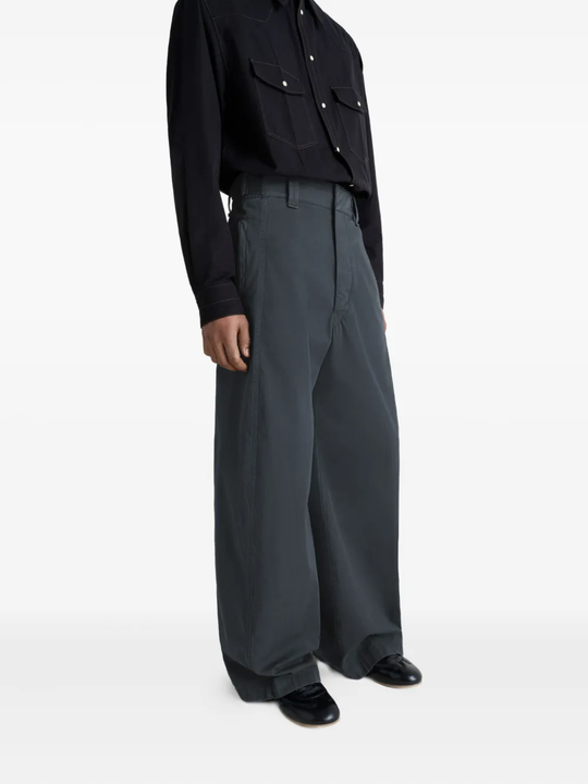 Grey pants worn by a person, showing the pants fit