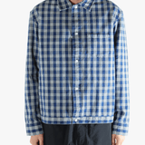 Blue shirt worn by a person, showing the shirt's fit