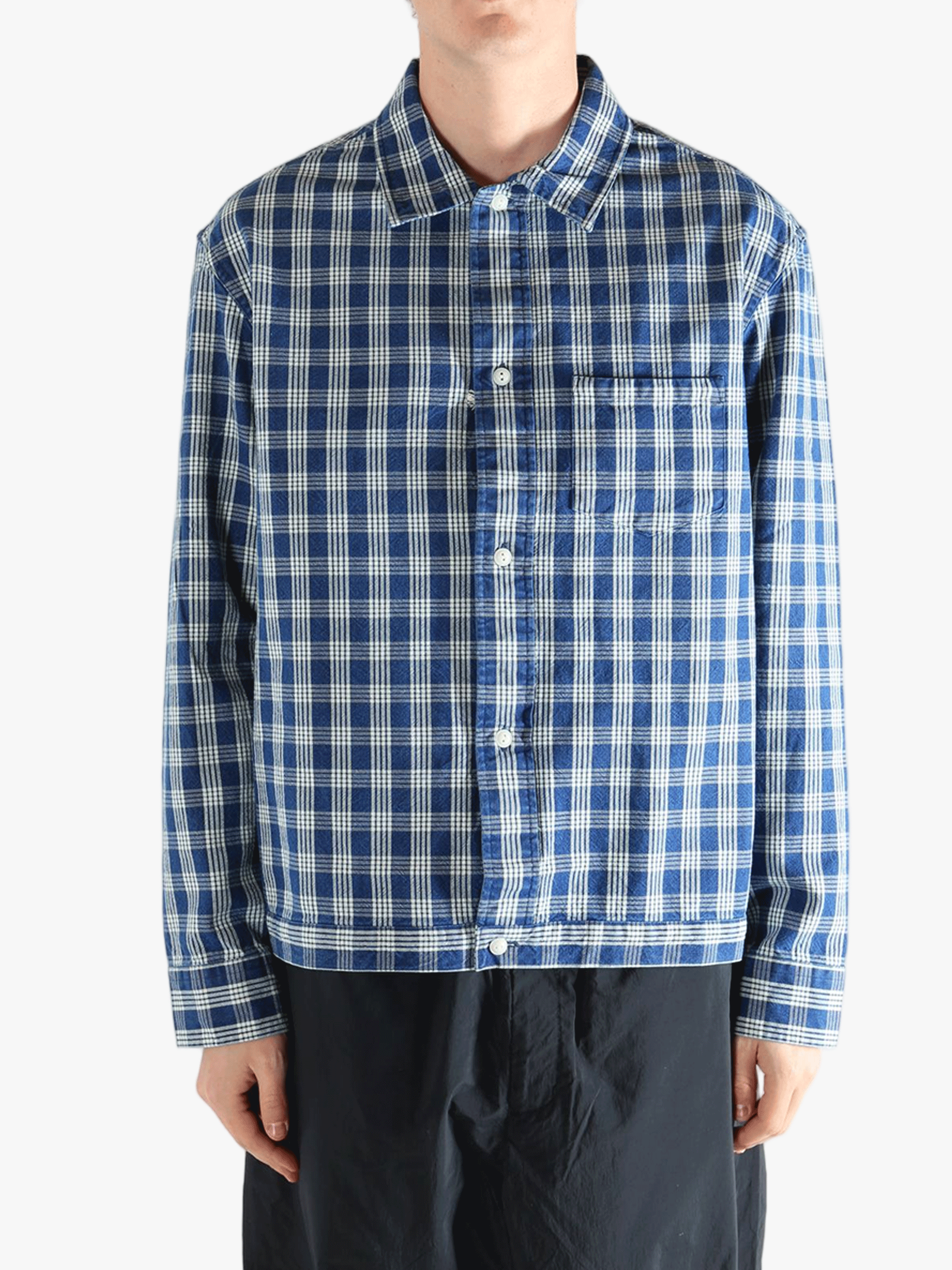 Blue shirt worn by a person, showing the shirt's fit