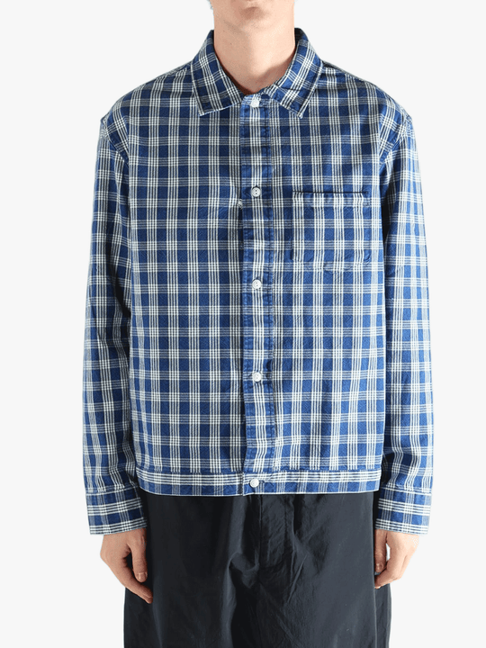 Blue shirt worn by a person, showing the shirt's fit