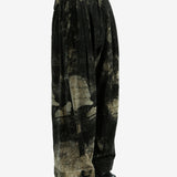 Black pants worn by a person, showing the pants fit