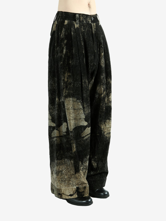 Black pants worn by a person, showing the pants fit