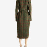 Green dress worn by a person, showing the dress fit