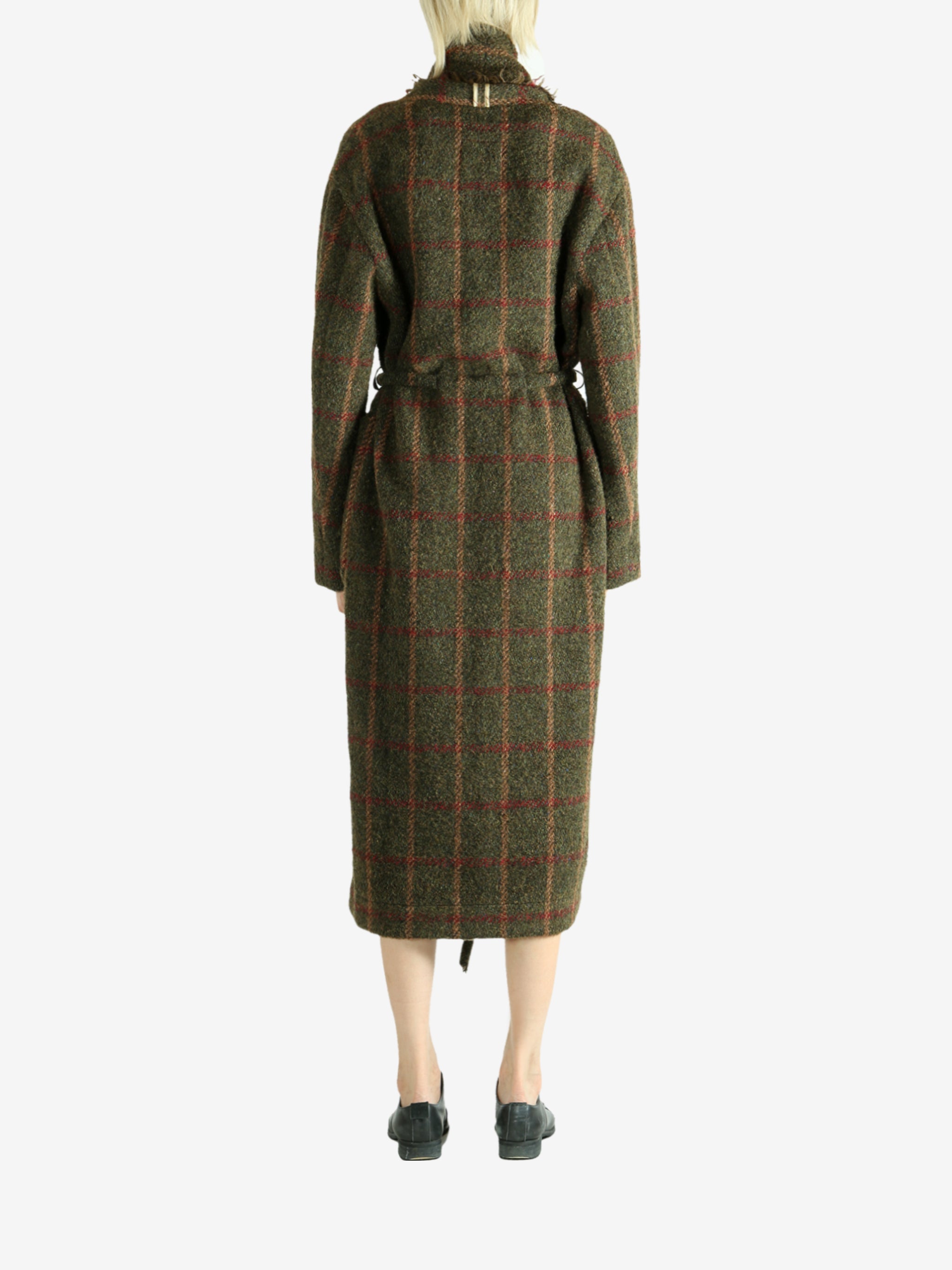 Green dress worn by a person, showing the dress fit