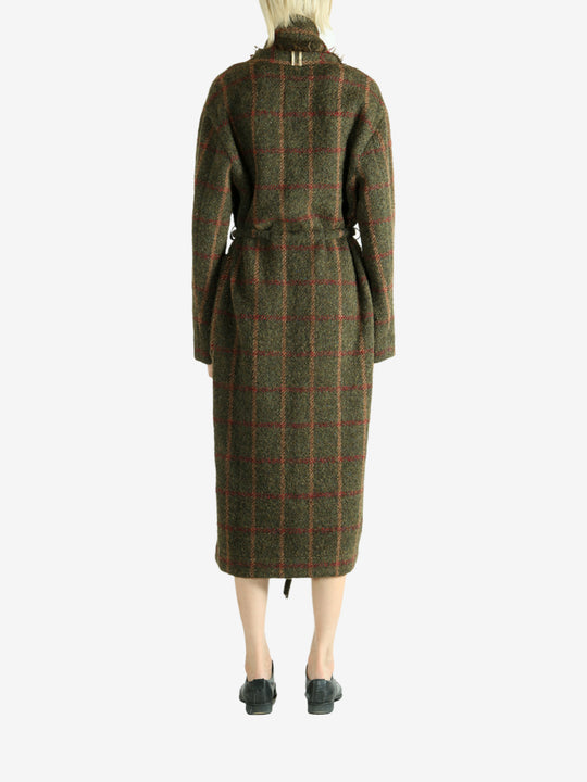 Green dress worn by a person, showing the dress fit