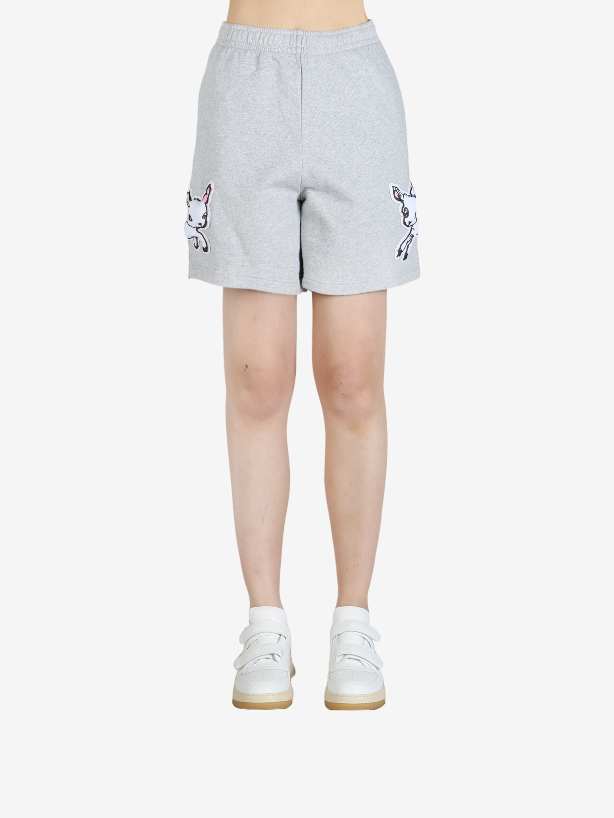 Grey pants worn by a person, showing the pants' fit