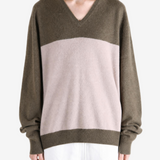 Brown hoodie worn by a person, showing the hoodie fit