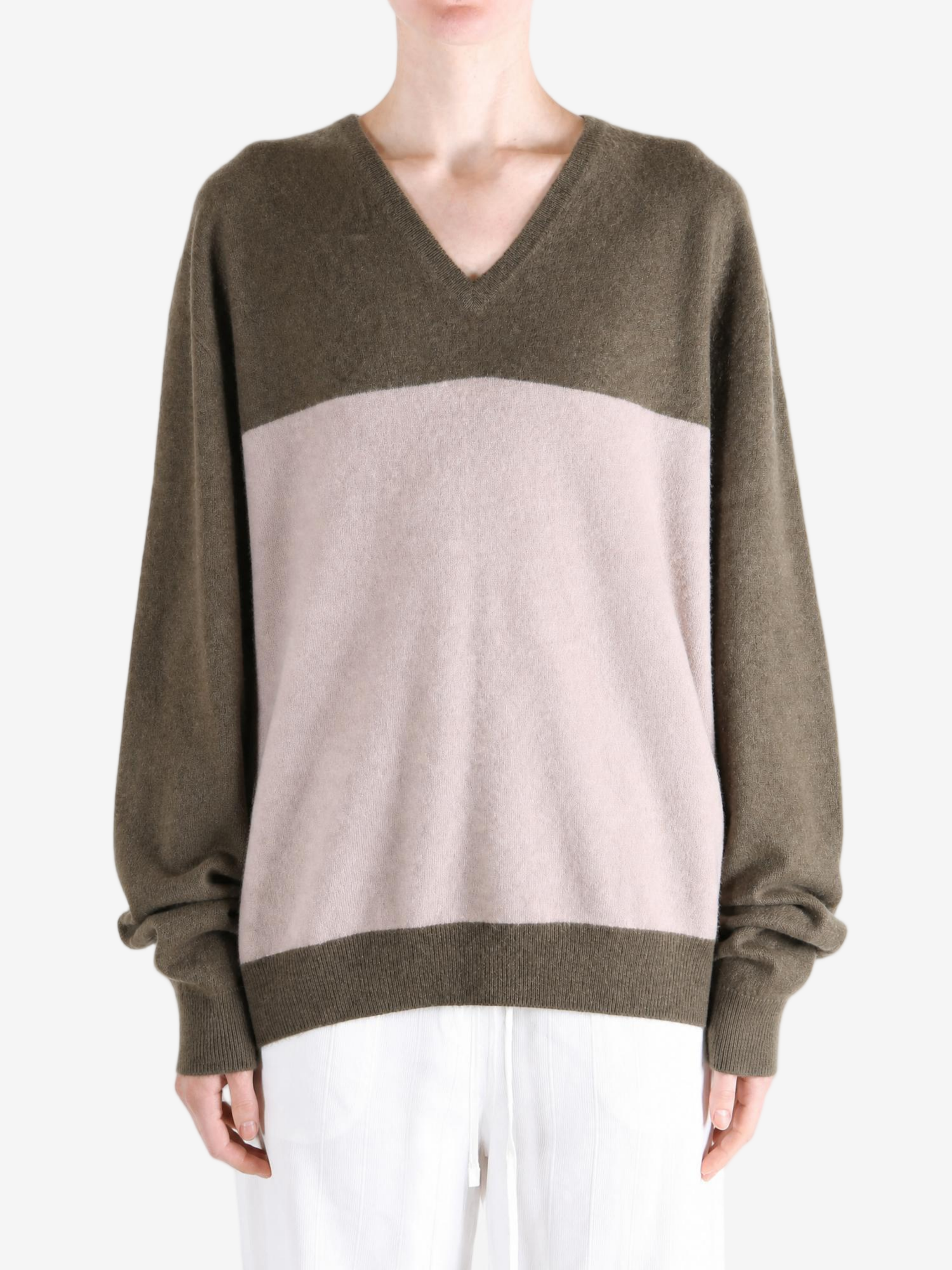 Brown hoodie worn by a person, showing the hoodie fit