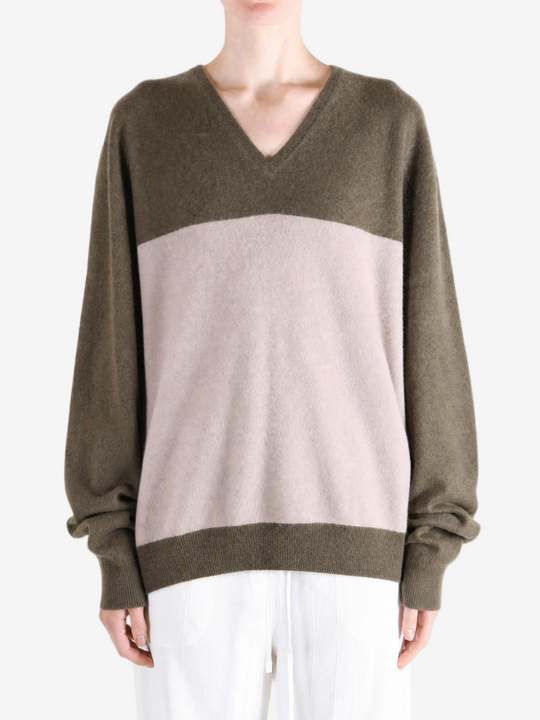 Brown hoodie worn by a person, showing the hoodie fit