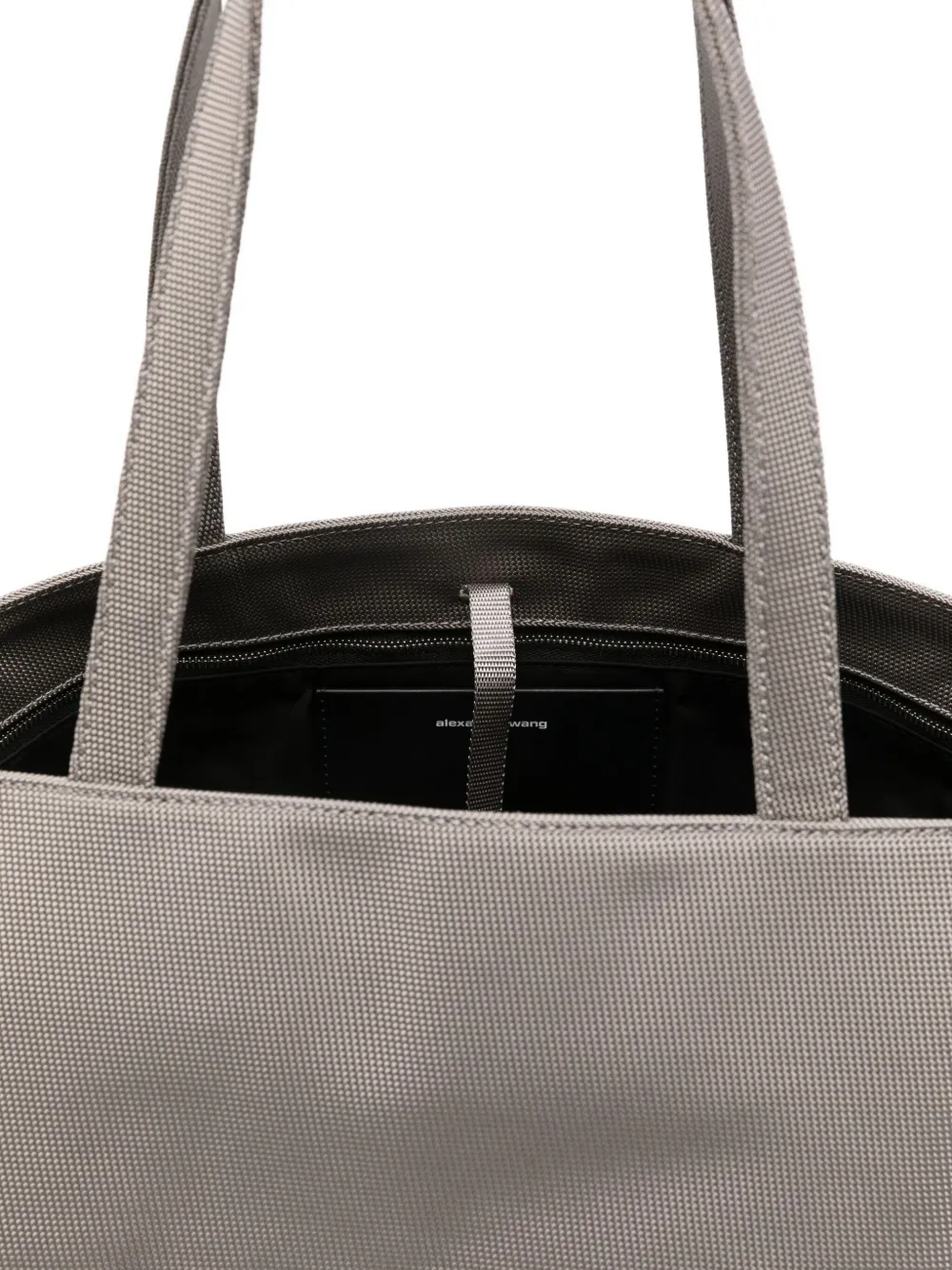Close up of grey bag,showing texture of the cotton fabric.