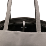 Close up of grey bag,showing texture of the cotton fabric.