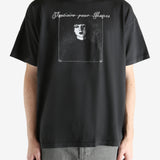 Black t-shirt worn by a person, showing the t-shirt's fit