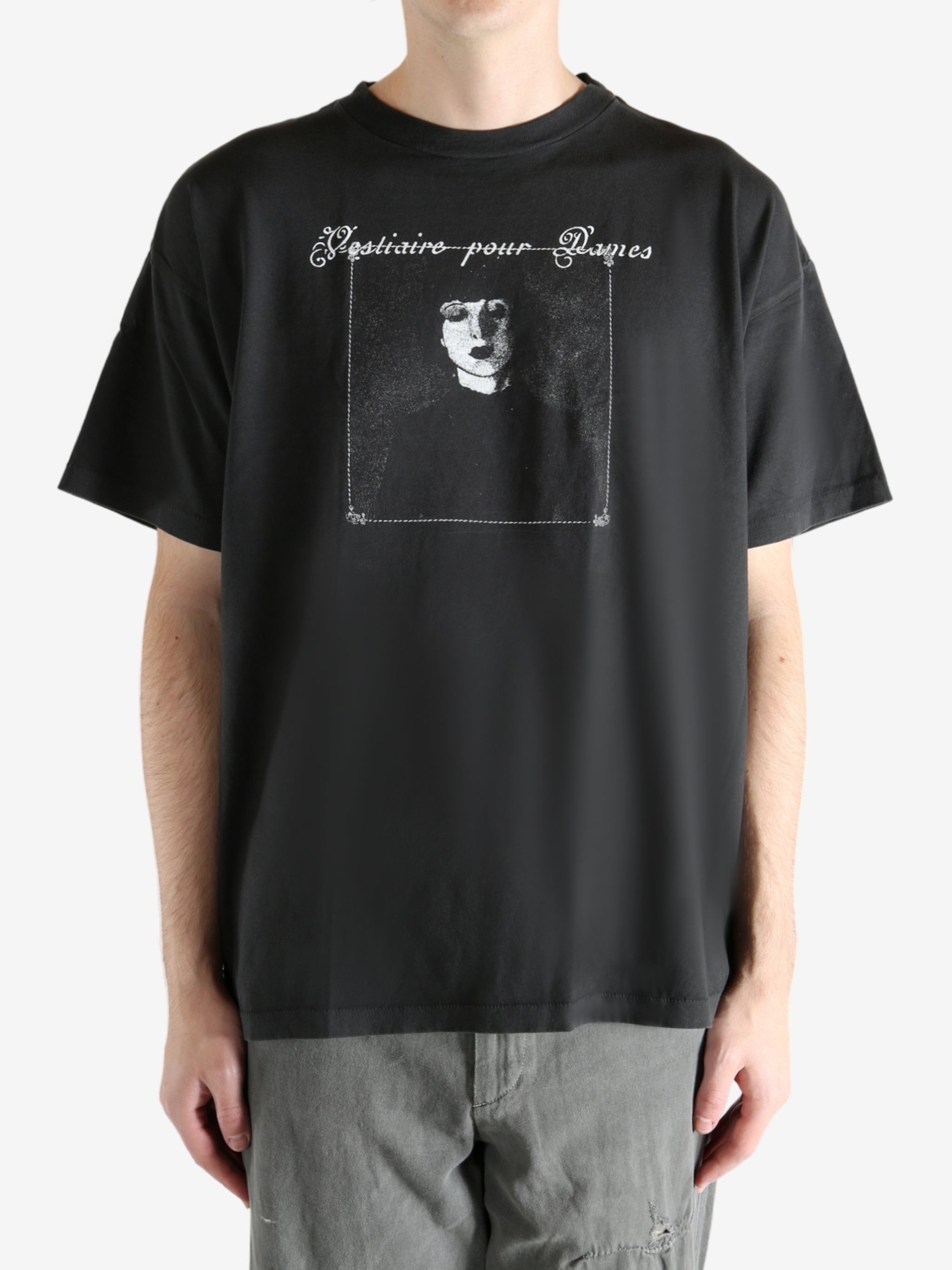 Black t-shirt worn by a person, showing the t-shirt's fit