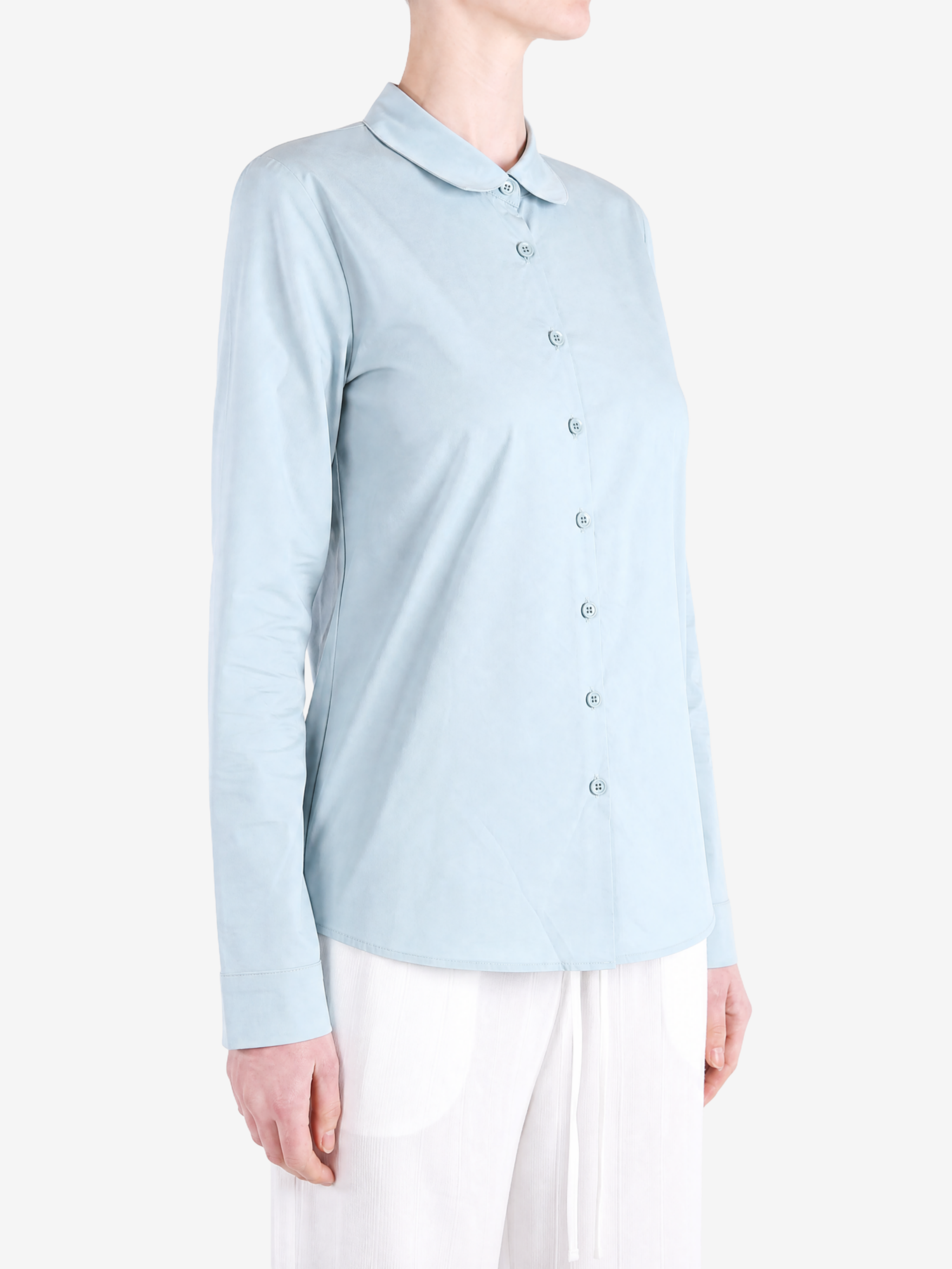 Green shirt worn by a person, showing the shirt fit