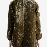 Green jacket worn by a person, showing the jacket fit