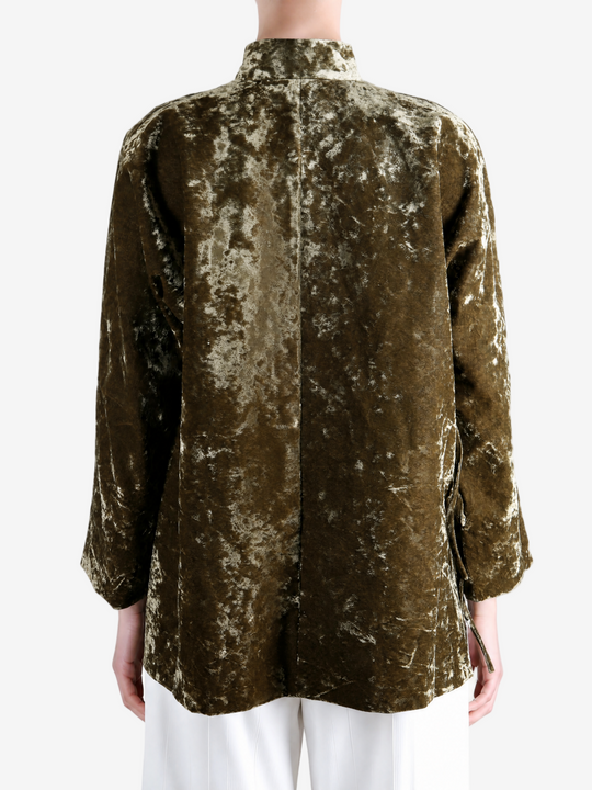 Green jacket worn by a person, showing the jacket fit