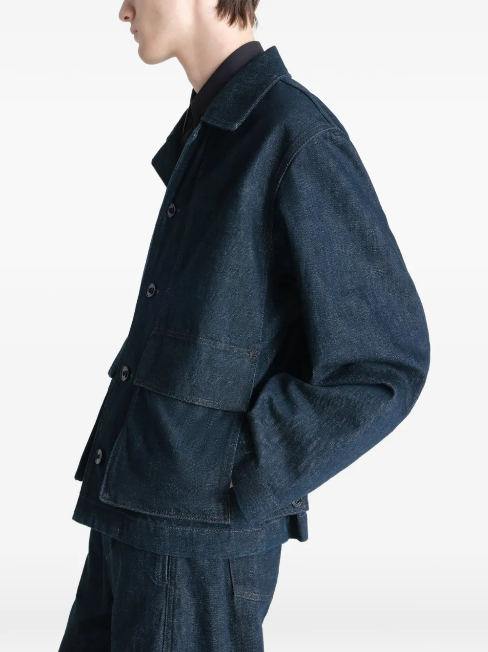 Blue jacket worn by a person, showing the jacket's fit