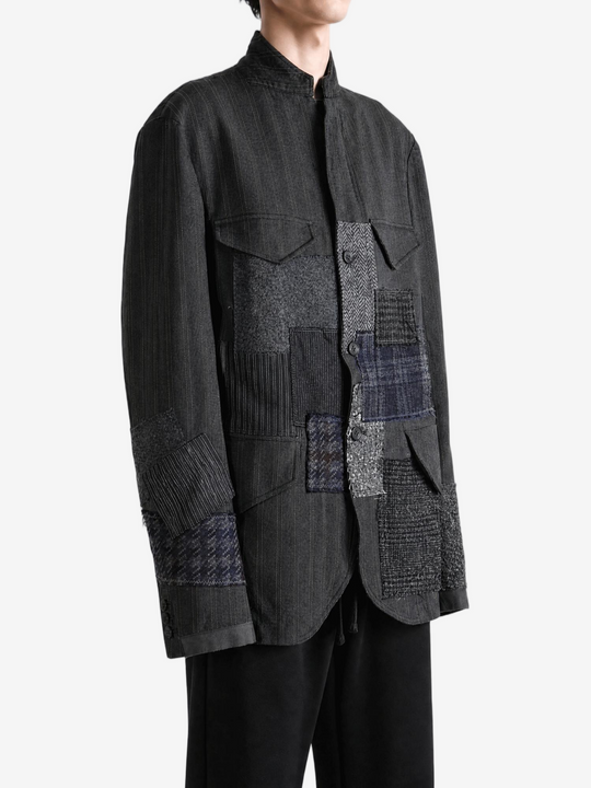 Grey jacket worn by a person, showing the jacket fit