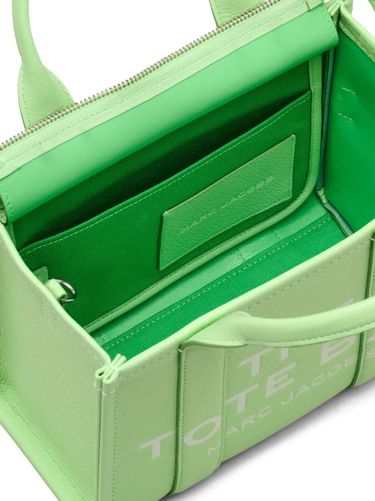 Close up of green bags,showing texture of the leather fabric.