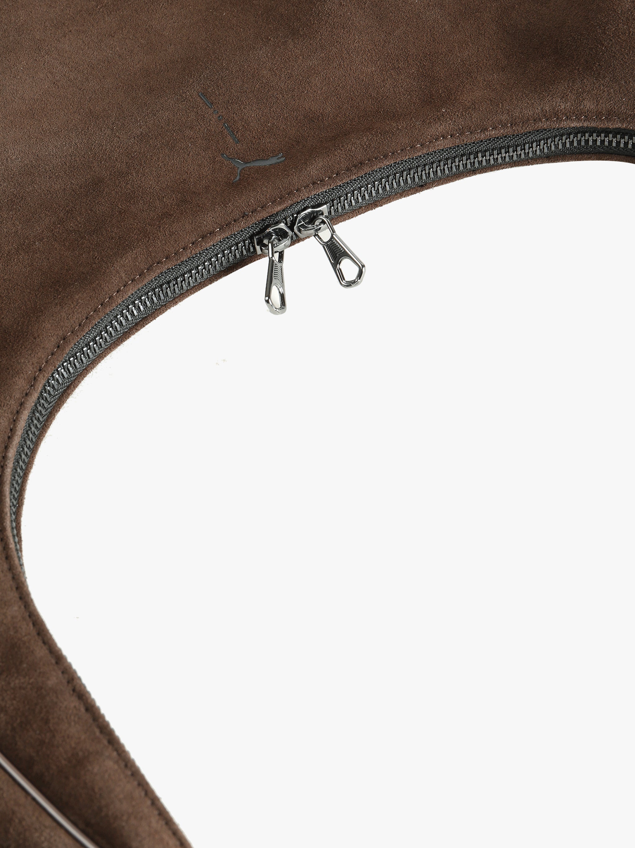 Close up of brown bag, showing texture of the leather fabric.