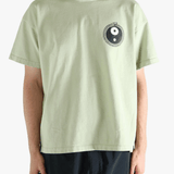 Green t-shirt worn by a person, showing the t-shirt's fit