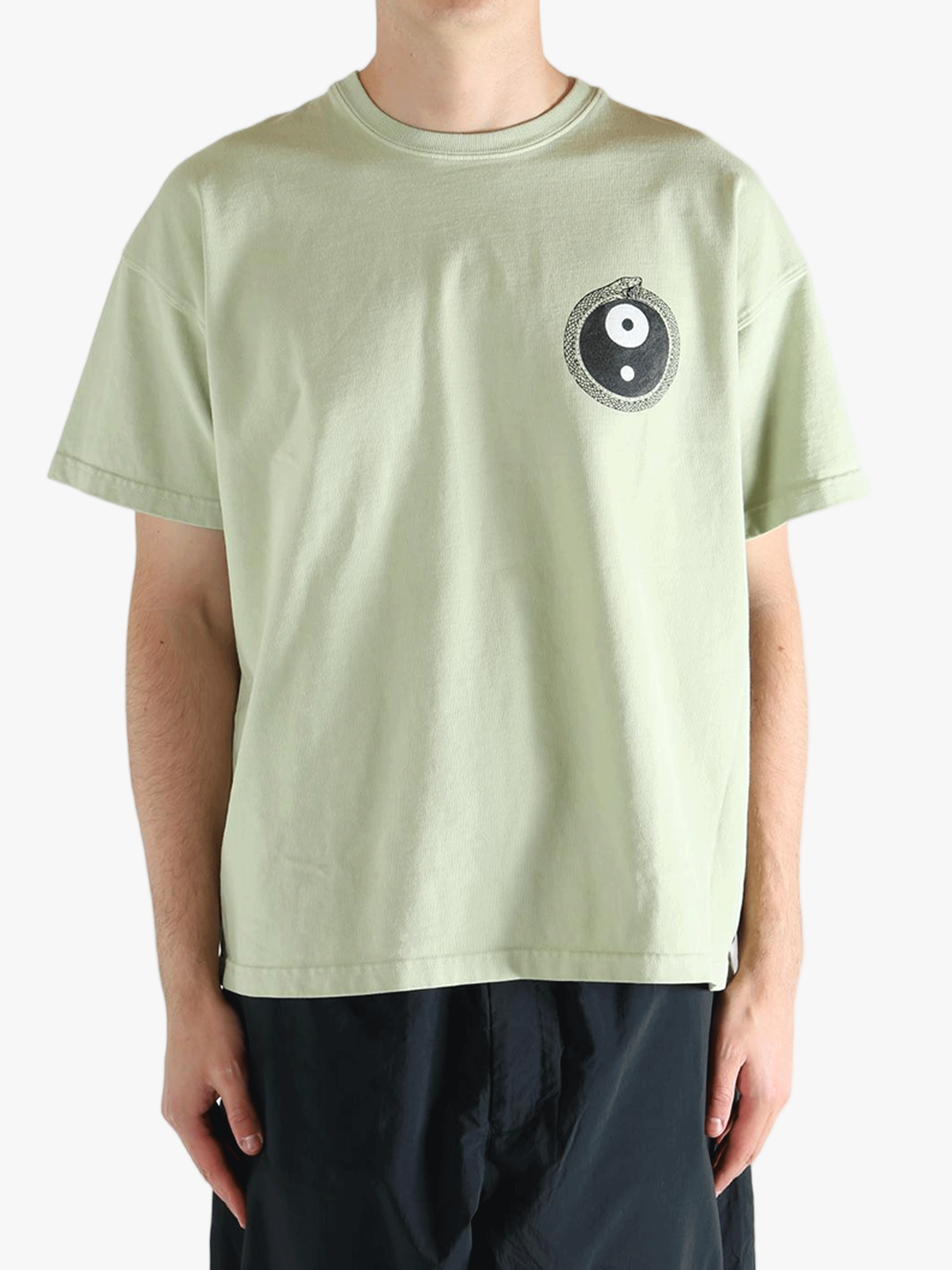 Green t-shirt worn by a person, showing the t-shirt's fit