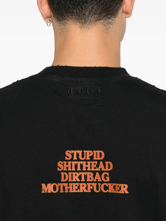 Close up of black t-shirts, showing texture of the cotton fabric