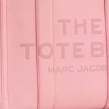 close up of pink bags, showing texture of the leather fabric