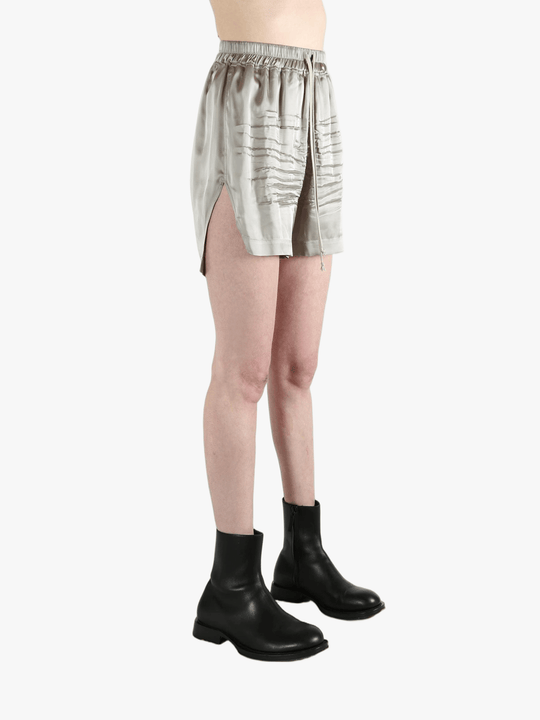 Grey shorts worn by a person, showing the shorts fit