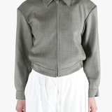 Grey jacket worn by a person, showing the jacket fit