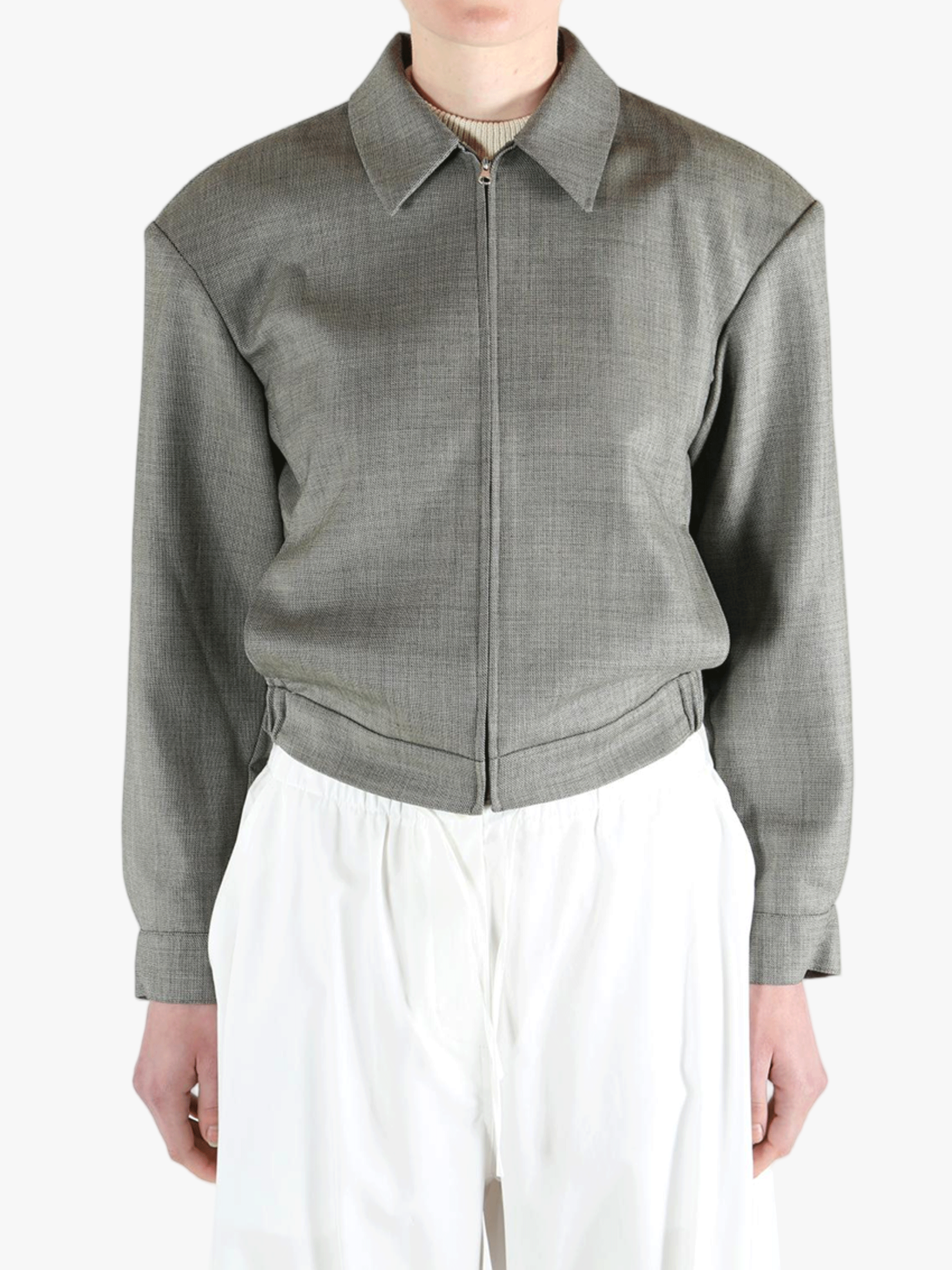 Grey jacket worn by a person, showing the jacket fit