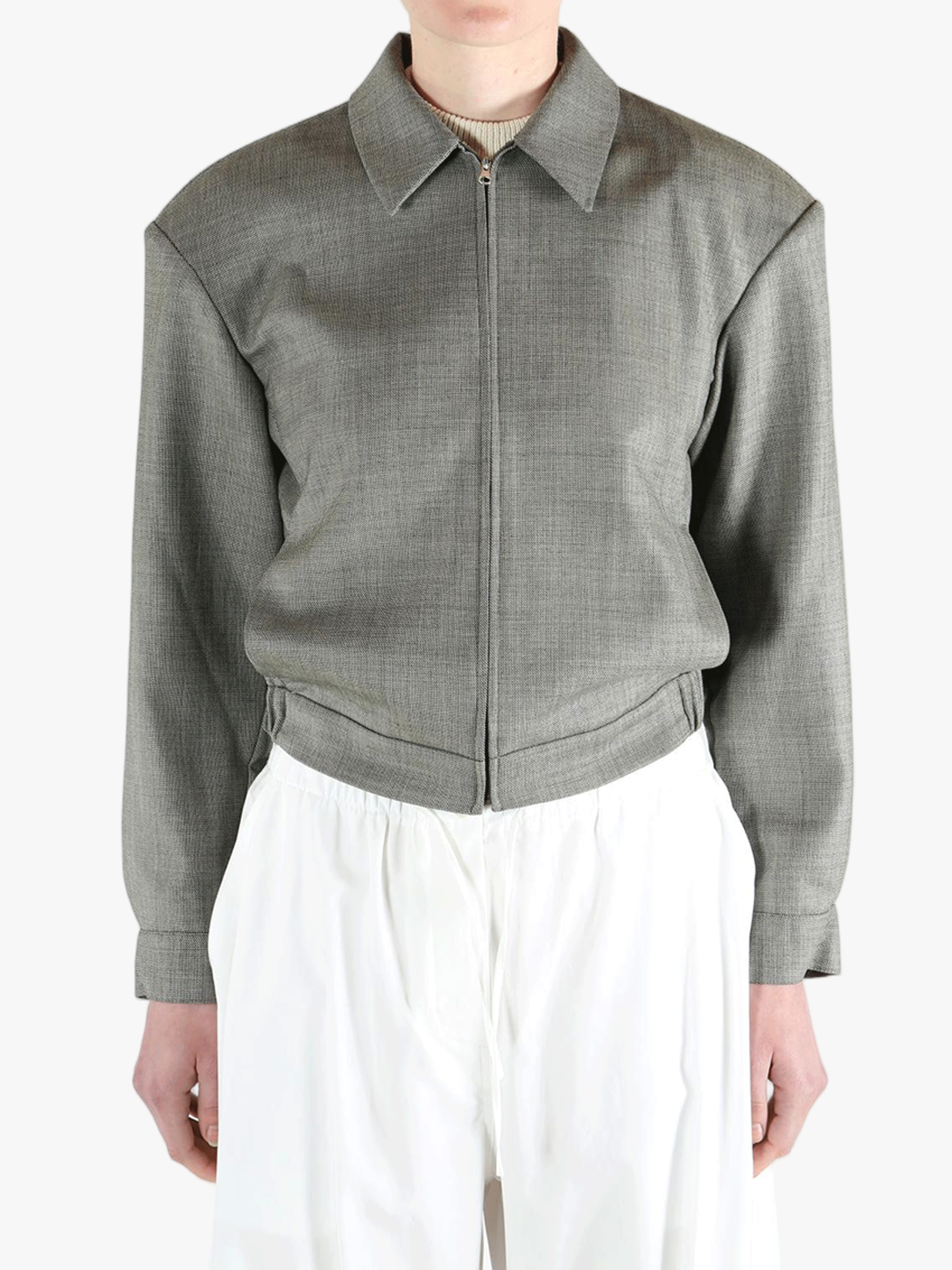 Grey jacket worn by a person, showing the jacket fit