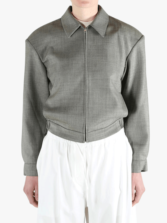 Grey jacket worn by a person, showing the jacket fit