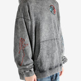 Black hoodie worn by a person, showing the hoodie's fit