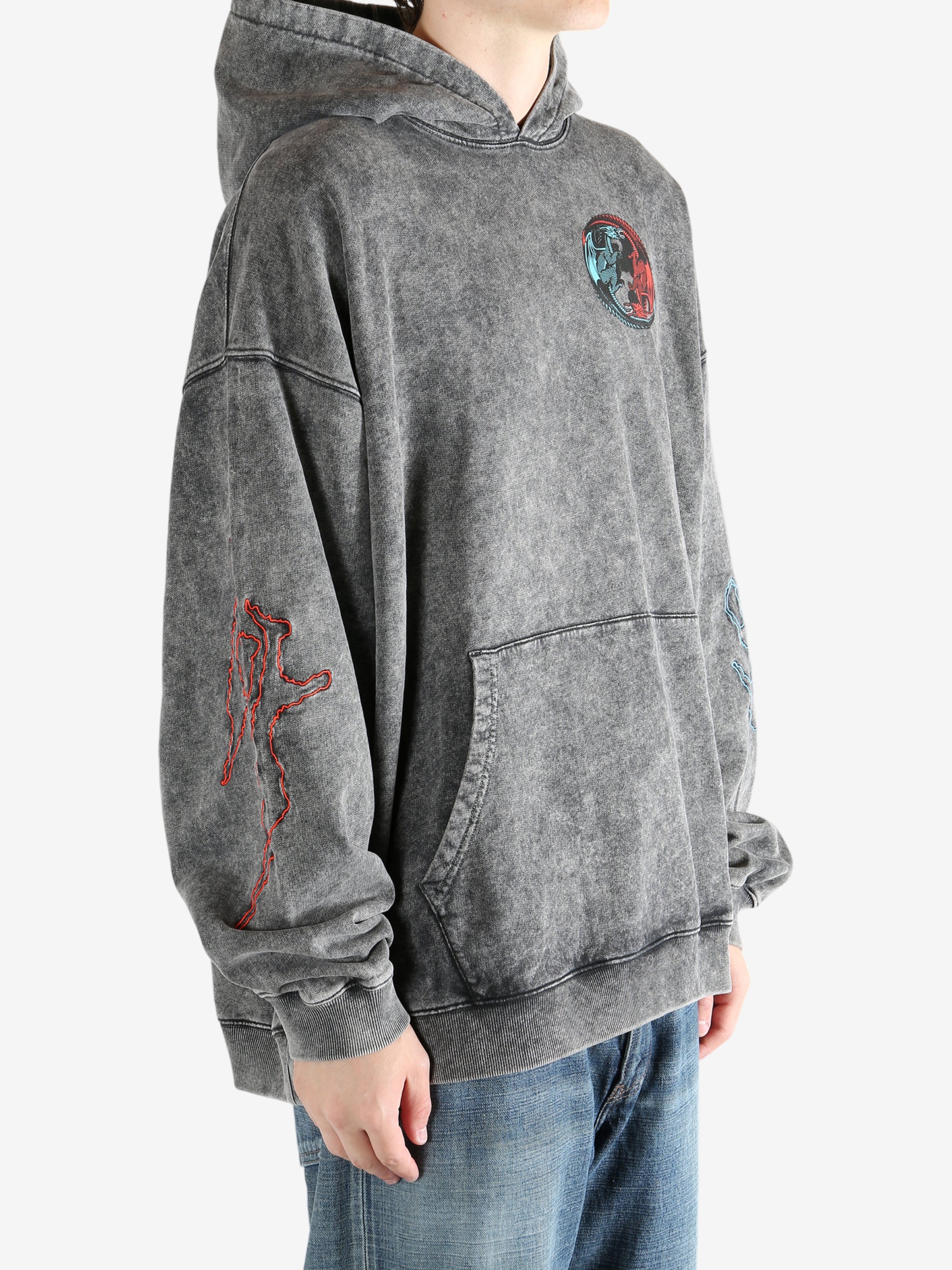 Black hoodie worn by a person, showing the hoodie's fit