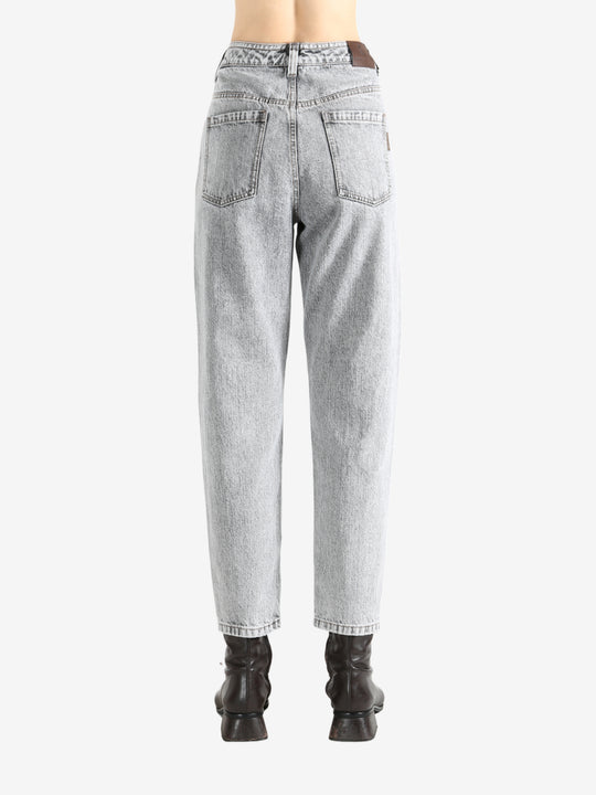 Grey pants worn by a person, showing the pants fit