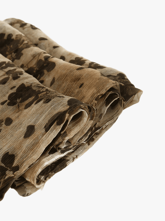 Close up of Tan scarf, showing texture of the 100% silk fabric