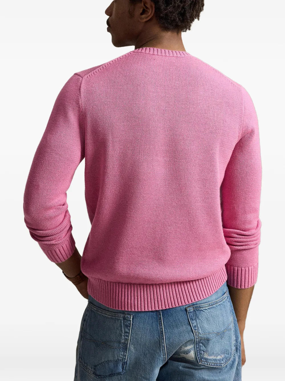 Pink knitwear worn by a person, showing the knitwear fit