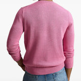 Pink knitwear worn by a person, showing the knitwear fit