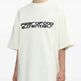 White Tee worn by a person, showing the T-shirt's ft