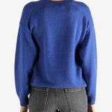 blue sweater worn by a person, showing the sweater fit