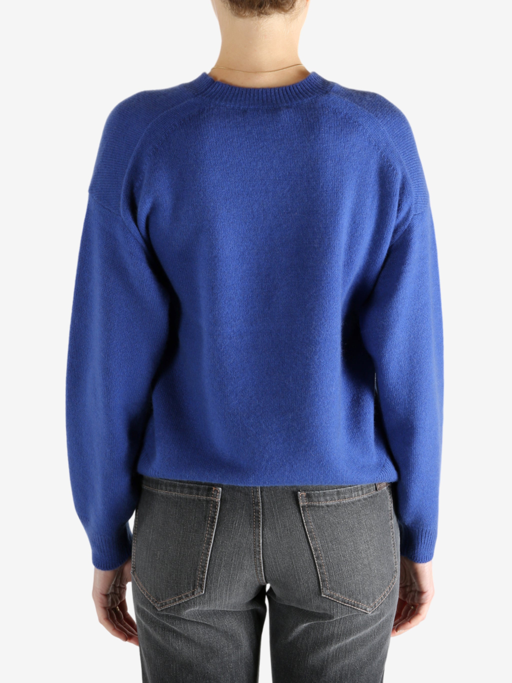 blue sweater worn by a person, showing the sweater fit